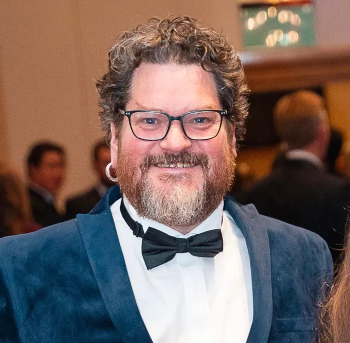 Tor Webster smiling in a bow tie